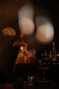 a blurry image of a woman at a bar